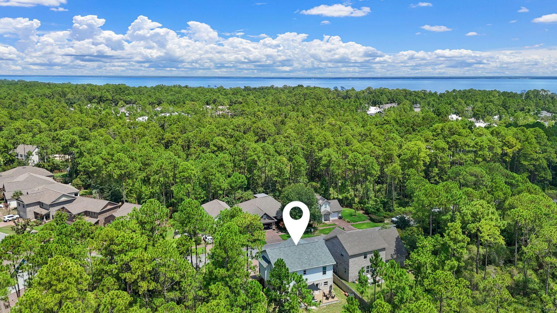 297 Cox Road Santa Rosa Beach, FL 32459 - Photo 40 of 41 a view of a back yard from a garden