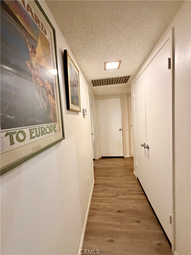 43127 40th Street East Lancaster, CA 93535 - Photo 15 of 24 Downstairs hallway to 3 bedrooms