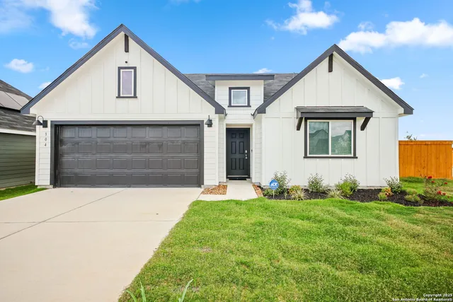 a front view of house with yard