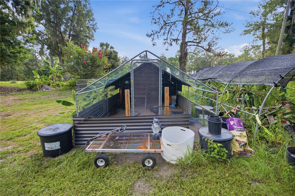 17900 Northwest 120th Avenue Road Reddick, FL 32686 - Photo 25 of 45 a backyard of a house with outdoor seating