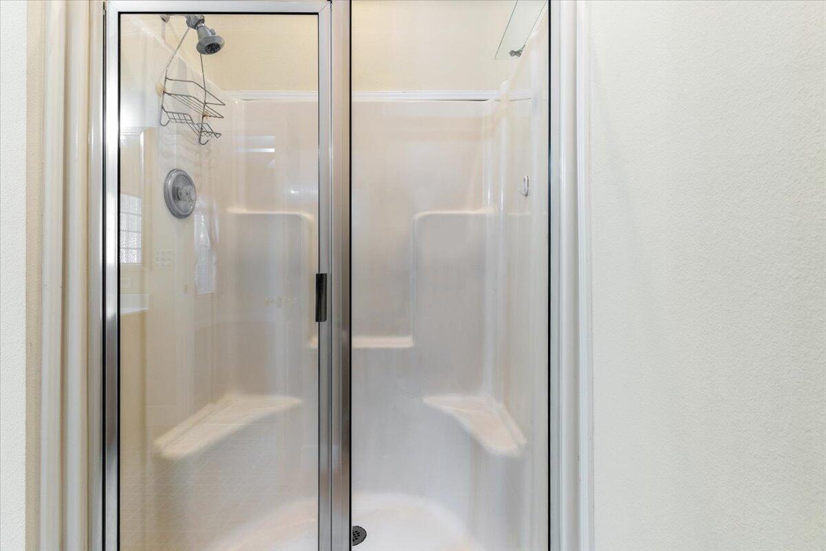 2941 Ferris Drive Navarre, FL 32566 - Photo 15 of 32 a bathroom with a glass shower door