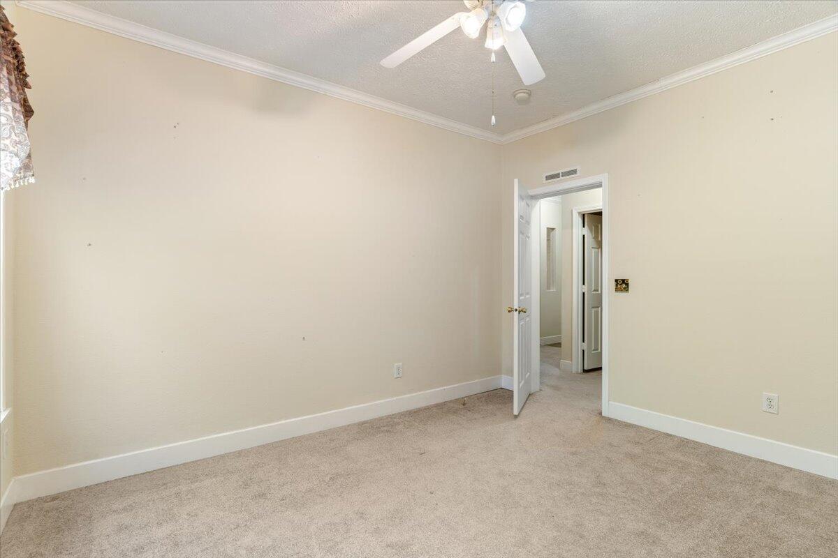 2941 Ferris Drive Navarre, FL 32566 - Photo 19 of 32 an empty room with a chandelier fan