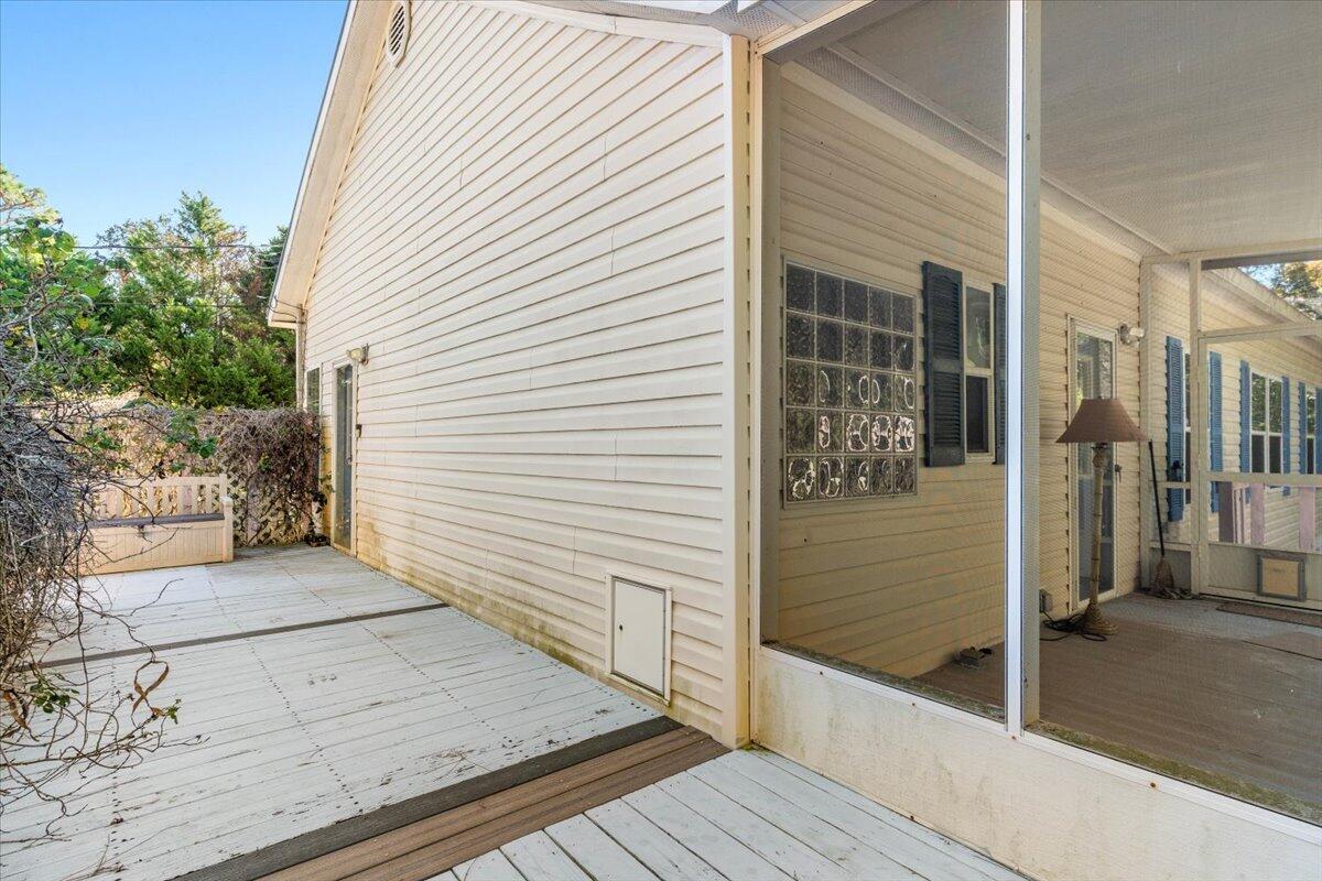 2941 Ferris Drive Navarre, FL 32566 - Photo 27 of 32 a view of a porch with wooden floor and a large window