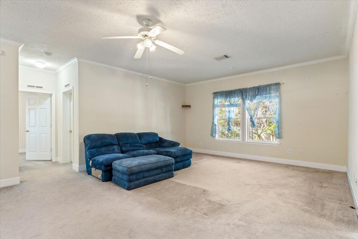2941 Ferris Drive Navarre, FL 32566 - Photo 5 of 32 a living room with furniture and a ceiling fan