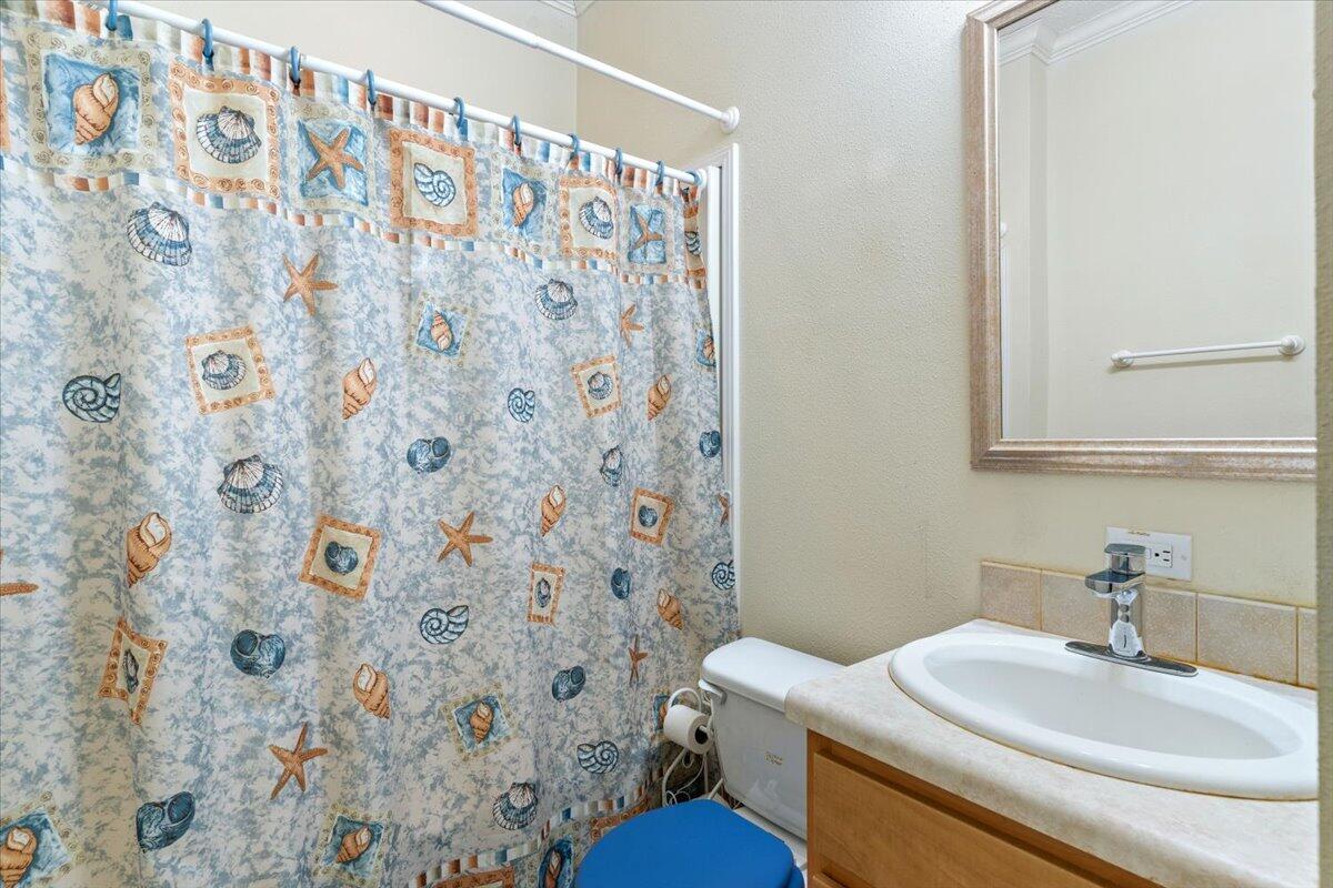 2941 Ferris Drive Navarre, FL 32566 - Photo 9 of 32 a bathroom with a sink toilet and a mirror