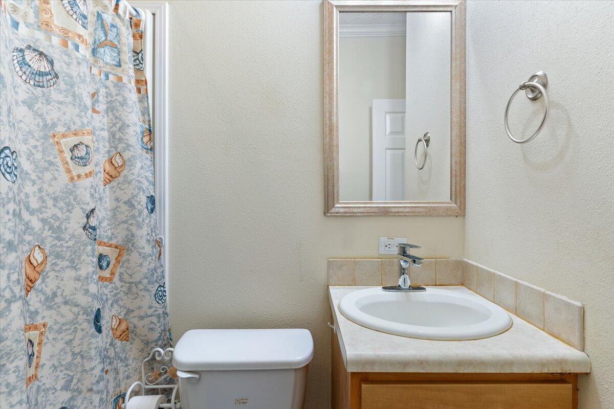 2941 Ferris Drive Navarre, FL 32566 - Photo 10 of 32 a bathroom with a sink toilet and shower