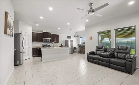 a living room with furniture and a large window
