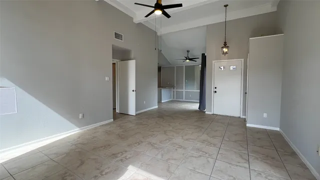 a view of a glass door and a living room