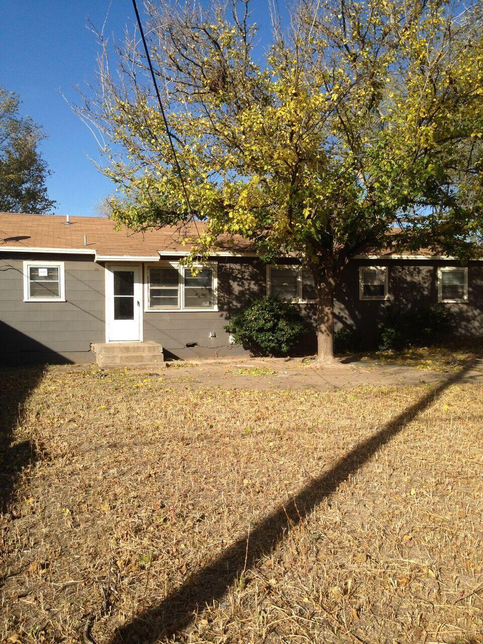 3815 25th Street Lubbock, TX 79410 - Photo 3 of 14 a view of a house with a yard
