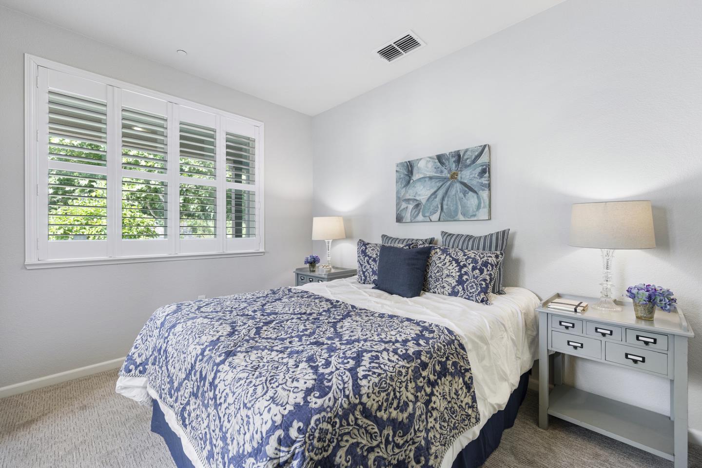 6063 Raleigh Road San Jose, CA 95123 - Photo 17 of 44 a bedroom with a large bed and a window