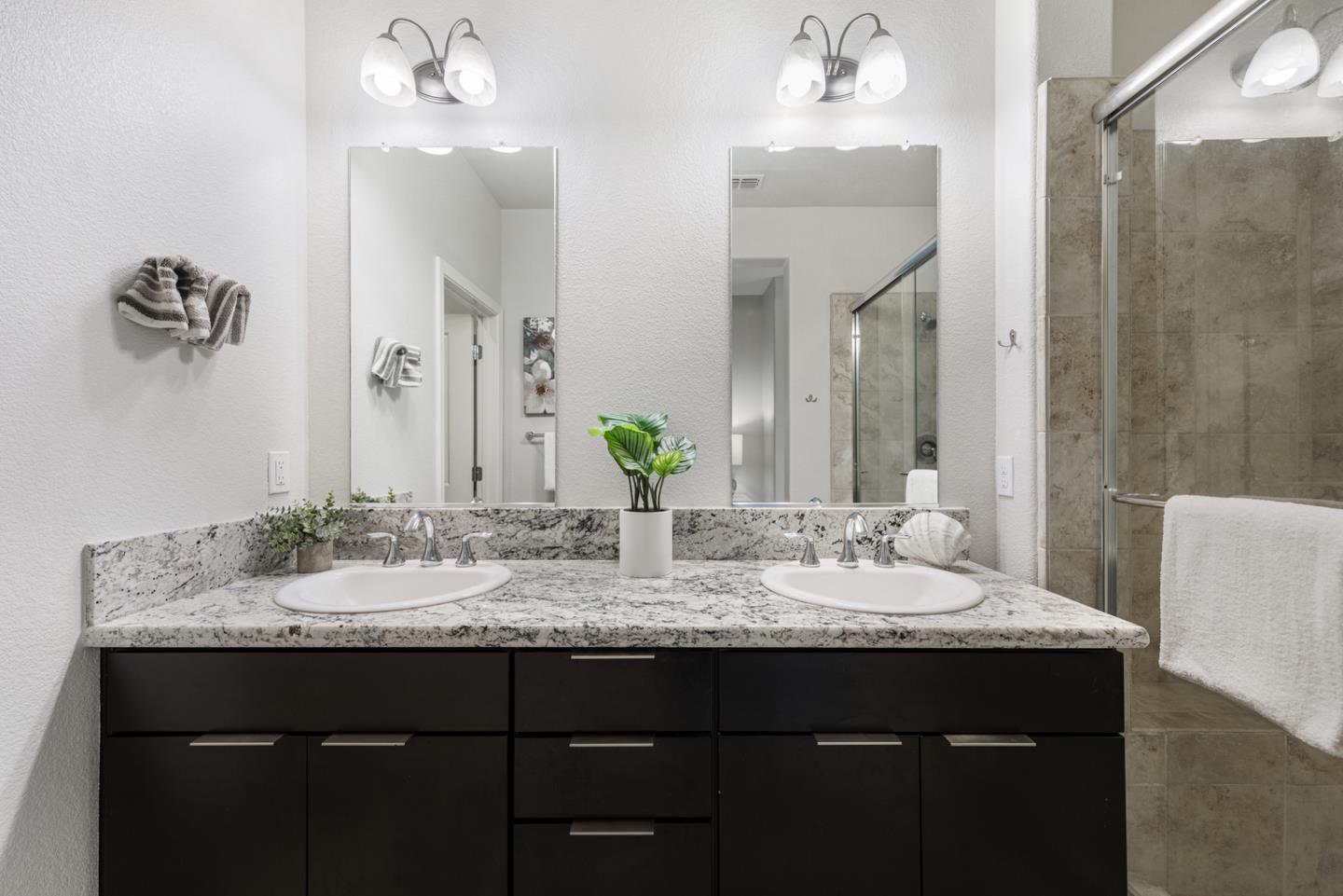 6063 Raleigh Road San Jose, CA 95123 - Photo 18 of 44 a bathroom with a granite countertop sink and a mirror