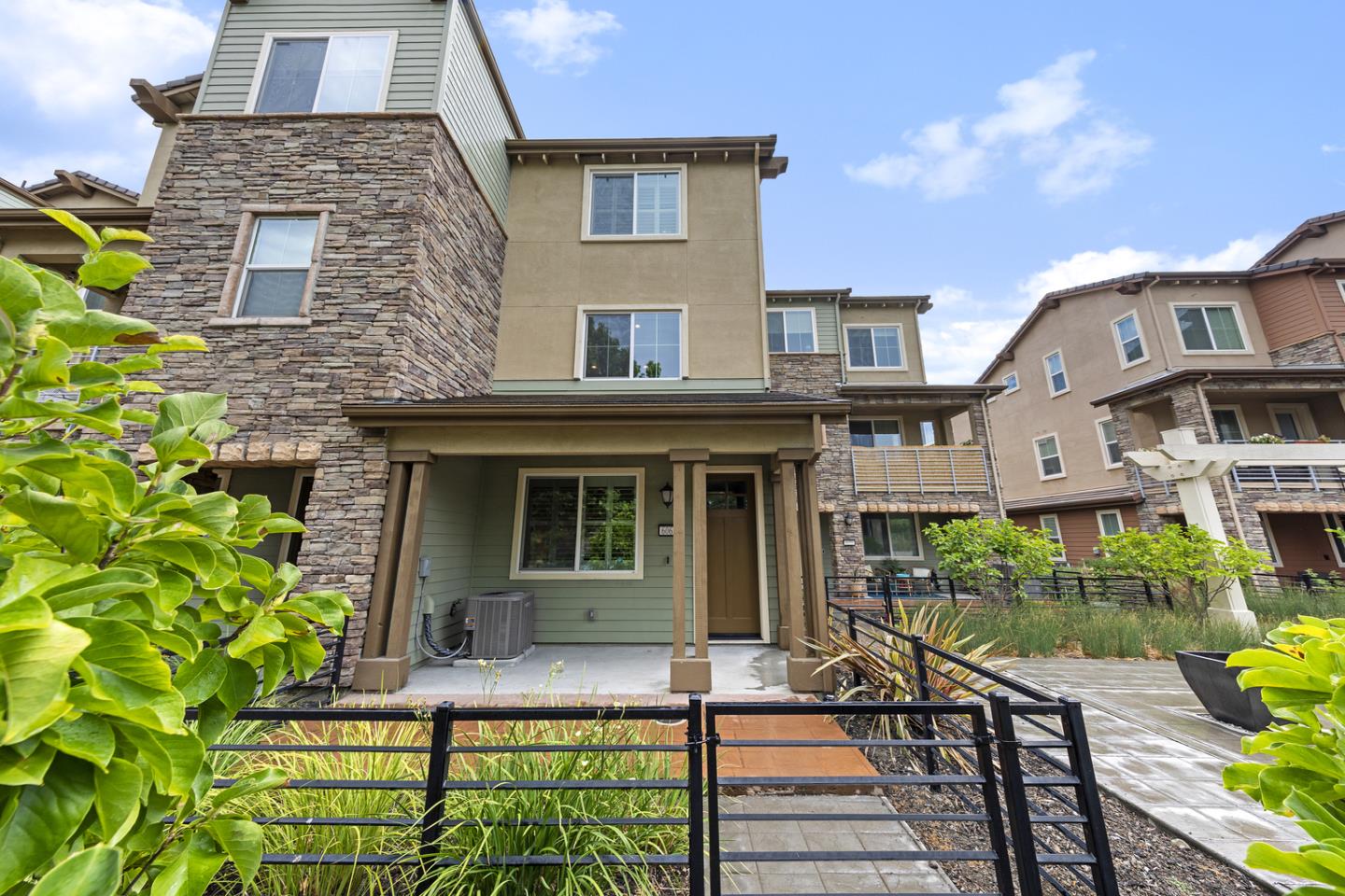 6063 Raleigh Road San Jose, CA 95123 - Photo 2 of 44 a front view of a house with garden