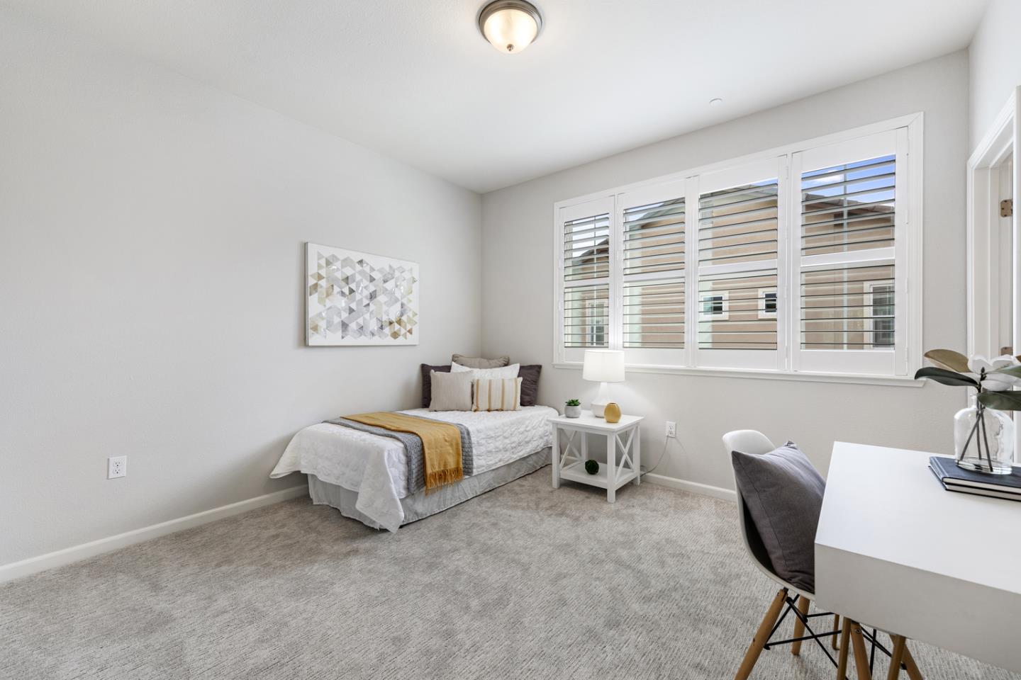 6063 Raleigh Road San Jose, CA 95123 - Photo 25 of 44 a spacious bedroom with a bed and a table