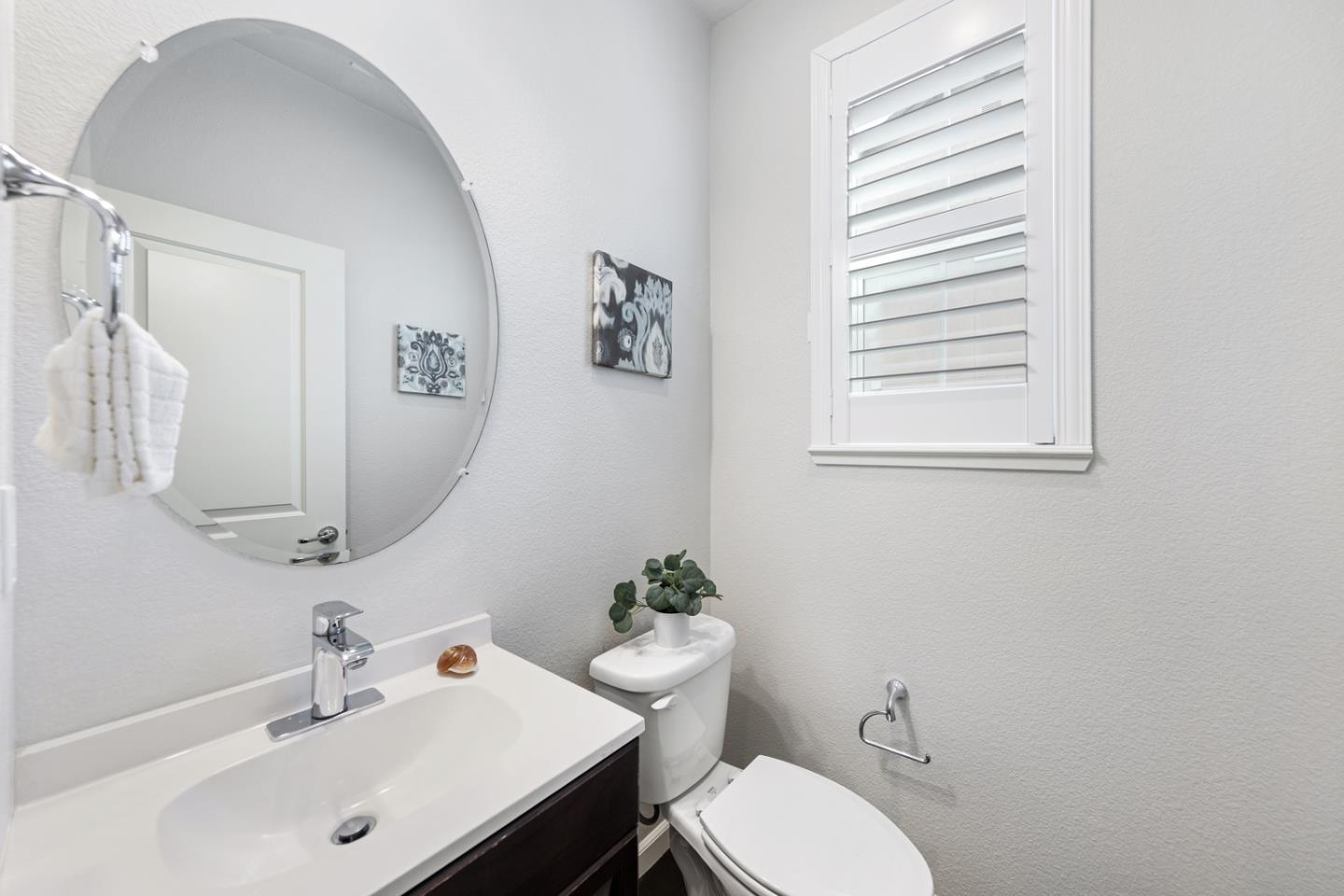 6063 Raleigh Road San Jose, CA 95123 - Photo 28 of 44 a bathroom with a sink mirror and toilet