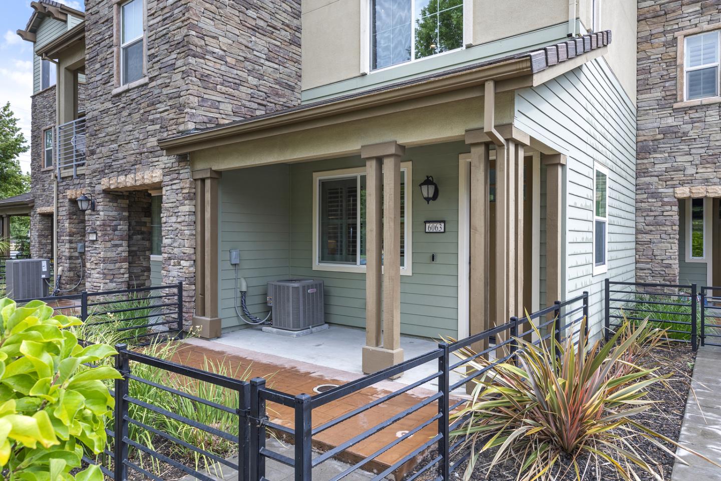 6063 Raleigh Road San Jose, CA 95123 - Photo 3 of 44 a front view of a house with a garden