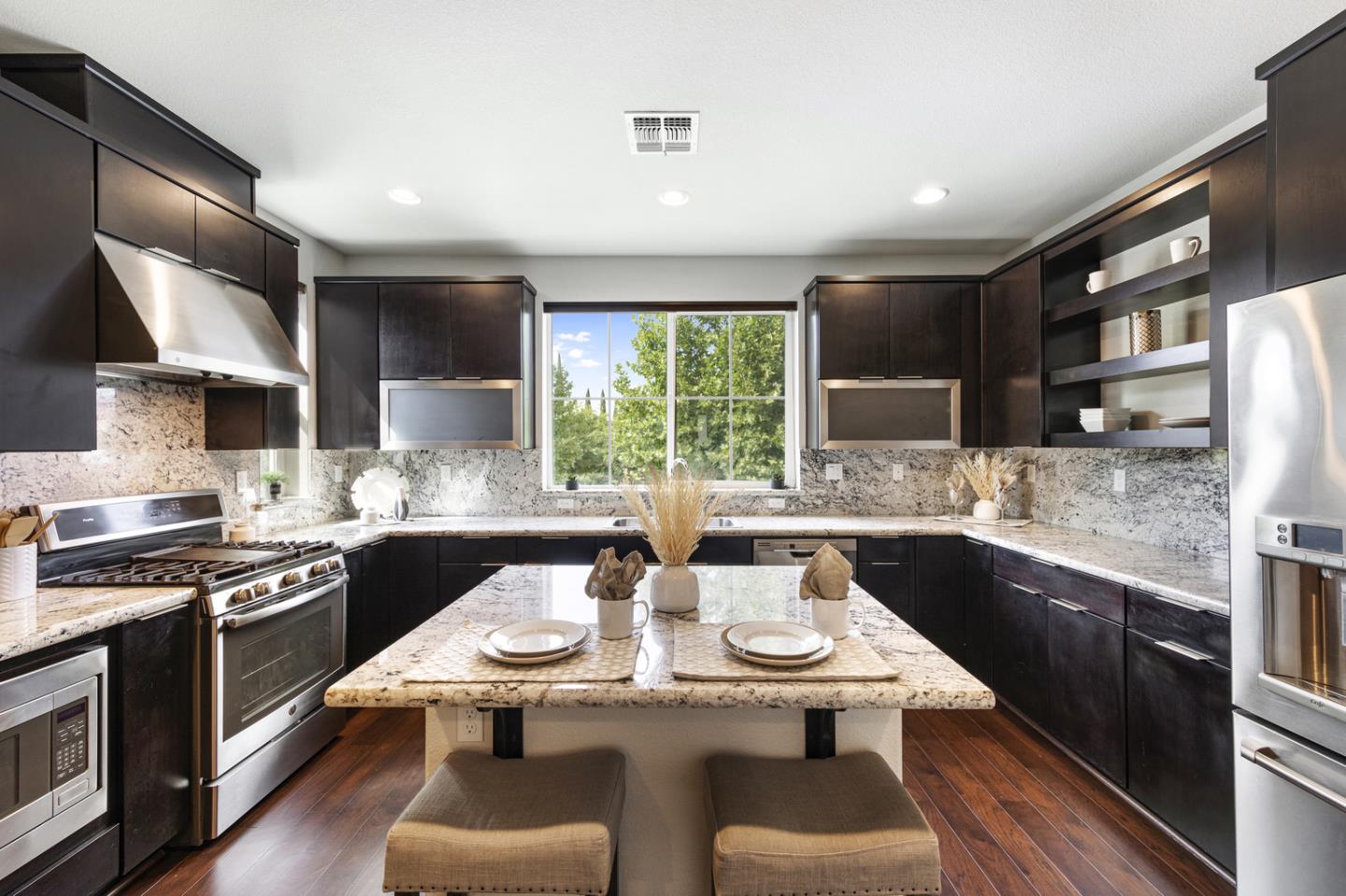 6063 Raleigh Road San Jose, CA 95123 - Photo 5 of 44 a kitchen with stainless steel appliances granite countertop a sink stove and refrigerator