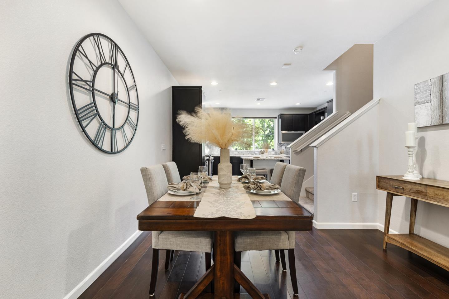 6063 Raleigh Road San Jose, CA 95123 - Photo 9 of 44 a view of a dining room with furniture a potted plant and wooden floor