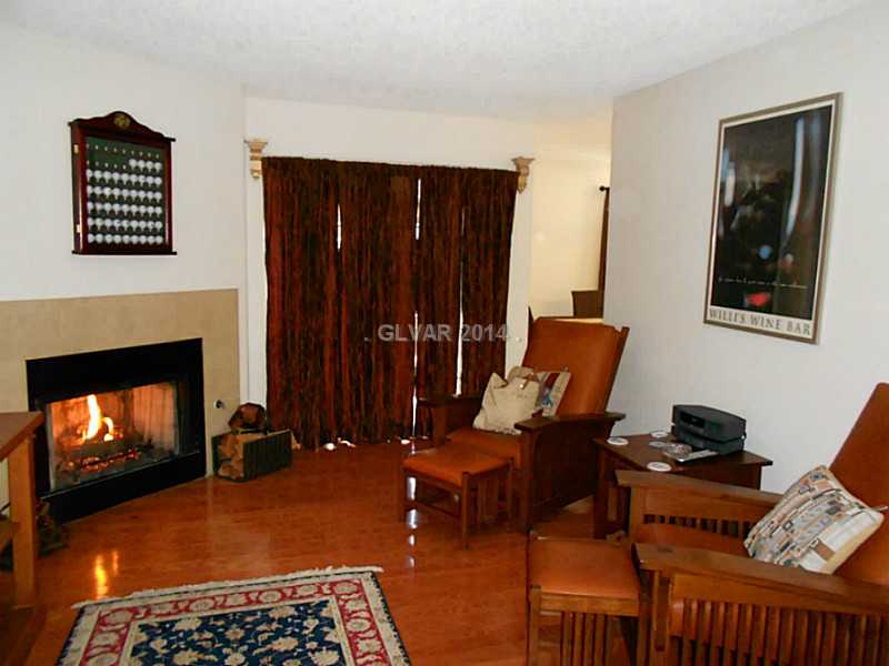 2200 South Fort Apache Road, Unit 1198 Las Vegas, NV 89117 - Photo 3 of 27 Living Room. Cozy living room with hardwood floors and fireplace