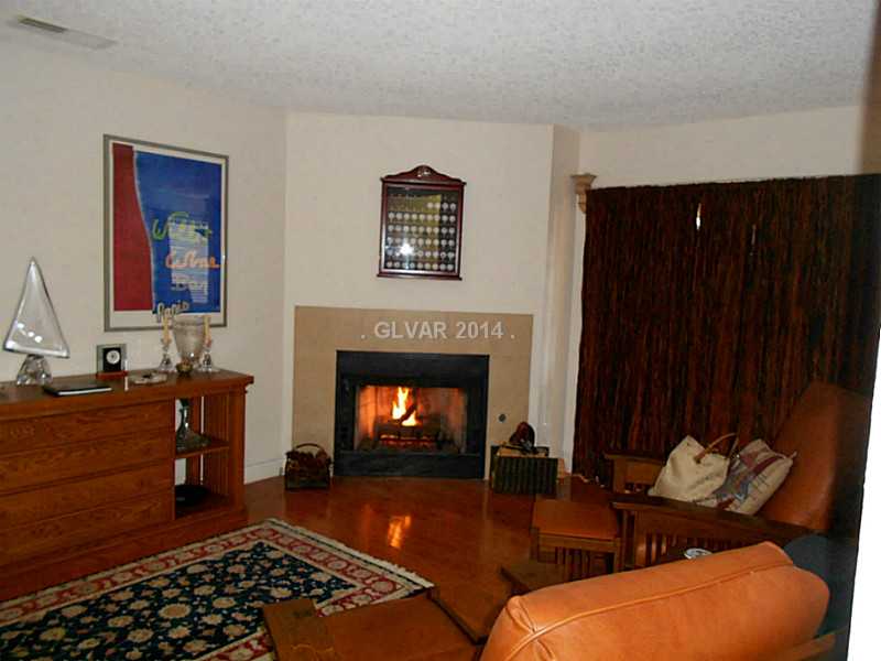 2200 South Fort Apache Road, Unit 1198 Las Vegas, NV 89117 - Photo 5 of 27 Living Room. Living room with access behind curtains to the patio area