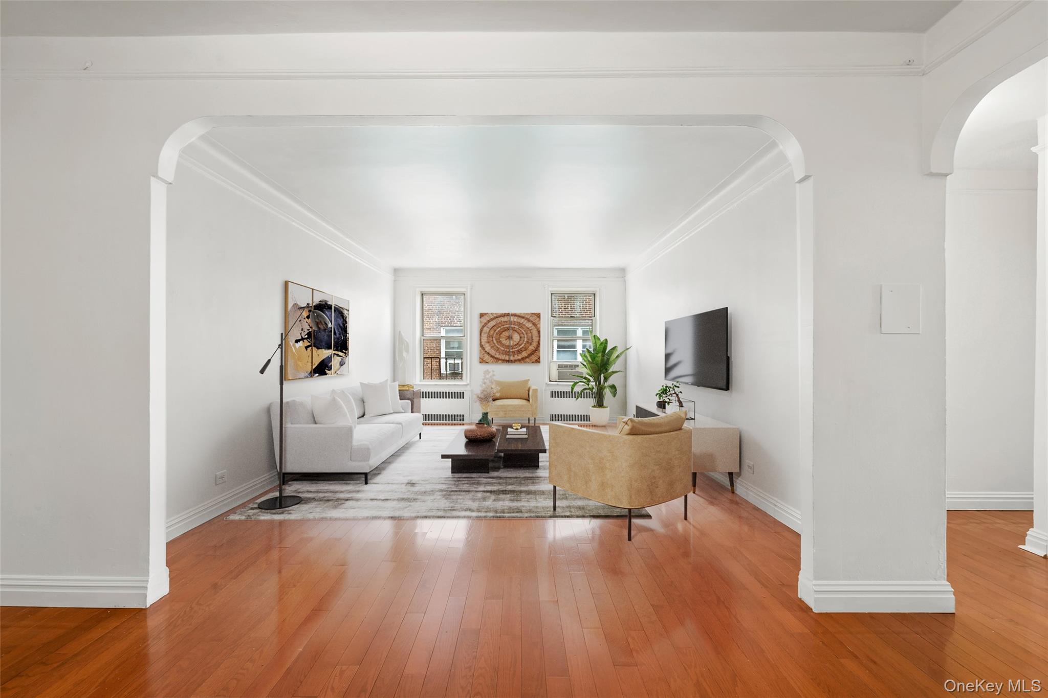 111-39 76th Road, Unit E7 Queens, NY 11375 - Photo 1 of 23 a living room with furniture and a flat screen tv