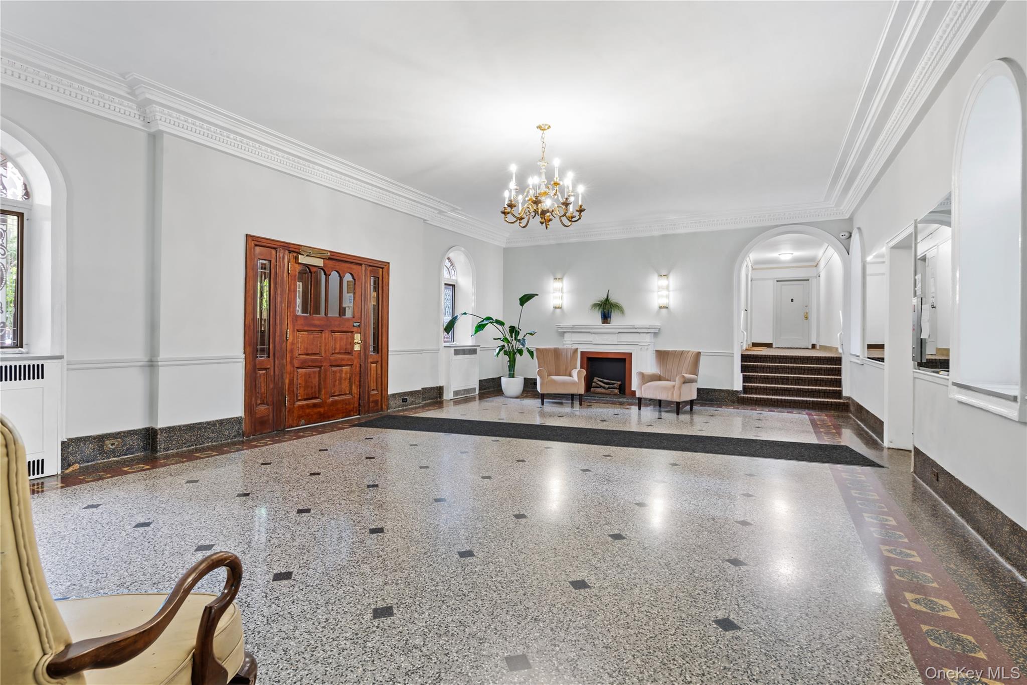 111-39 76th Road, Unit E7 Queens, NY 11375 - Photo 15 of 23 a lobby with furniture and a chandelier