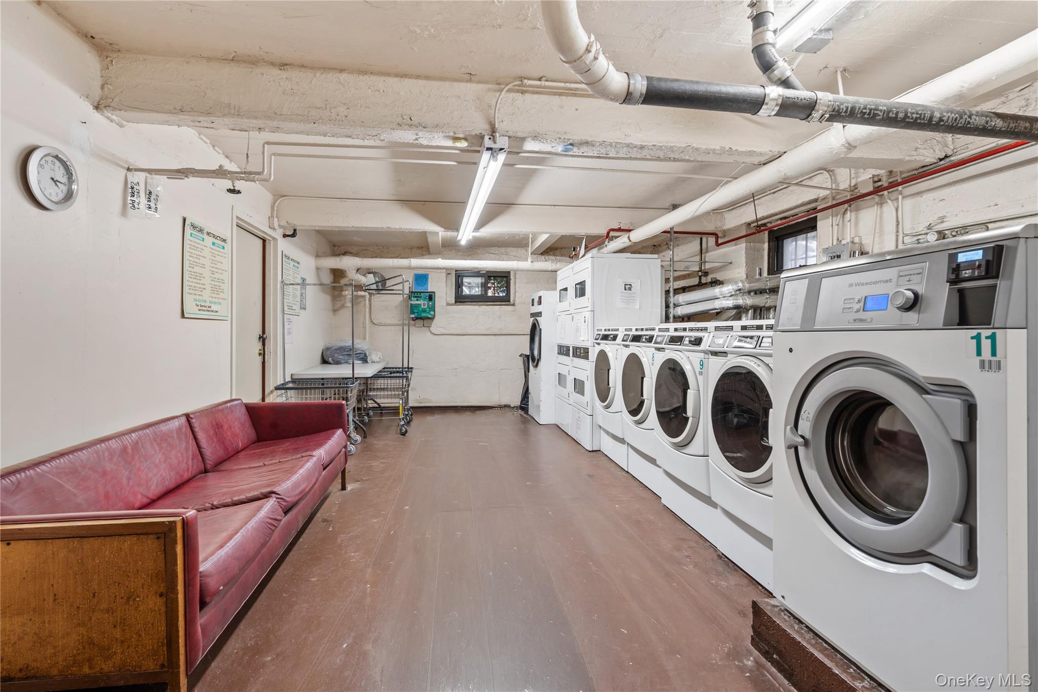 111-39 76th Road, Unit E7 Queens, NY 11375 - Photo 16 of 23 a utility room with dryer and washer