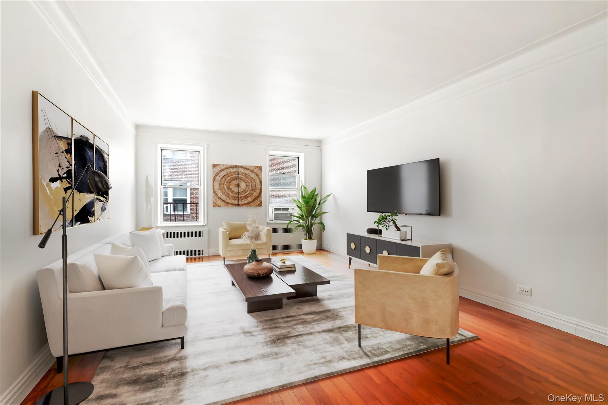 111-39 76th Road, Unit E7 Queens, NY 11375 - Photo 3 of 23 a living room with furniture and a flat screen tv