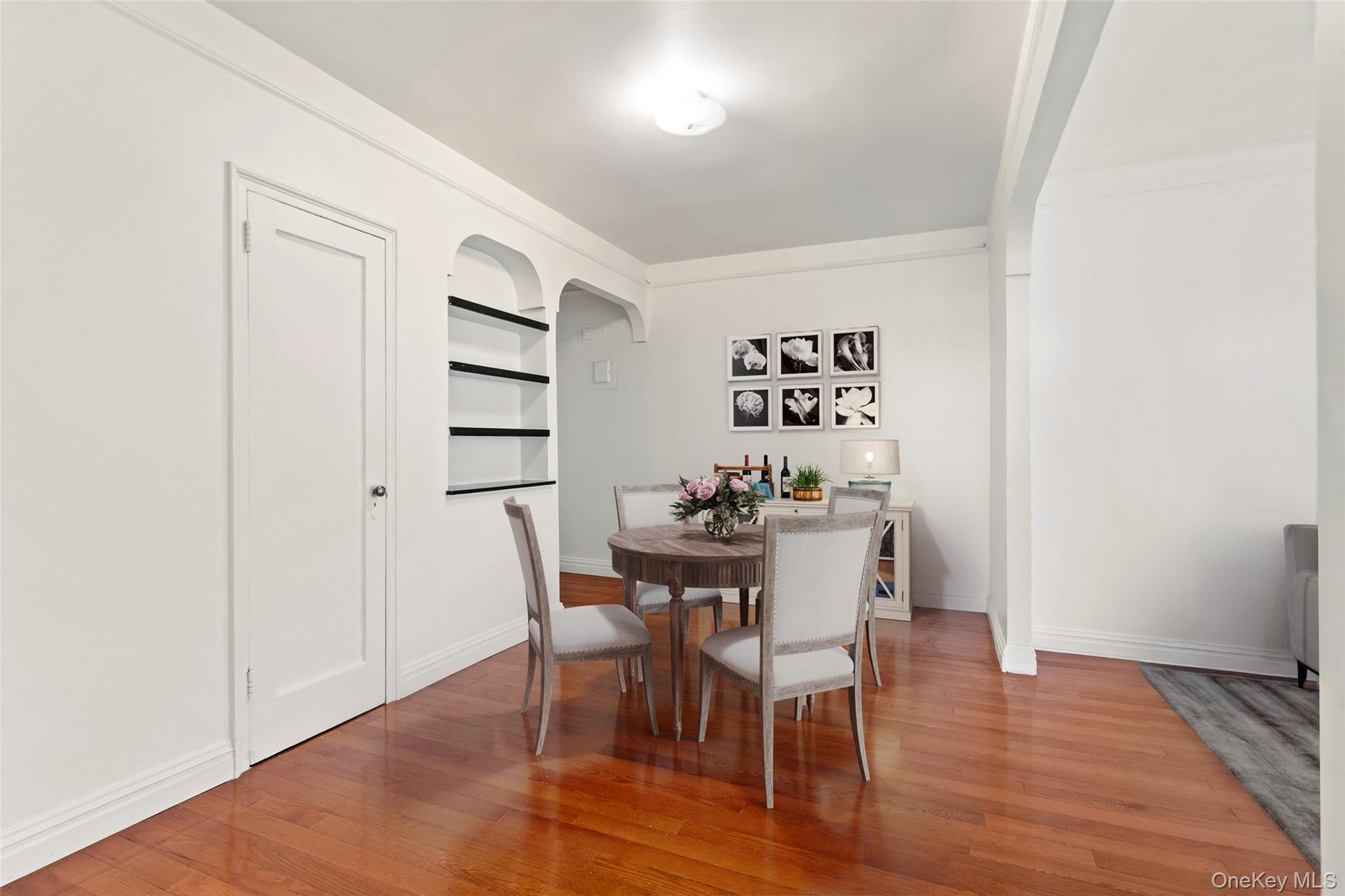 111-39 76th Road, Unit E7 Queens, NY 11375 - Photo 5 of 23 a view of a dining room with furniture and wooden floor