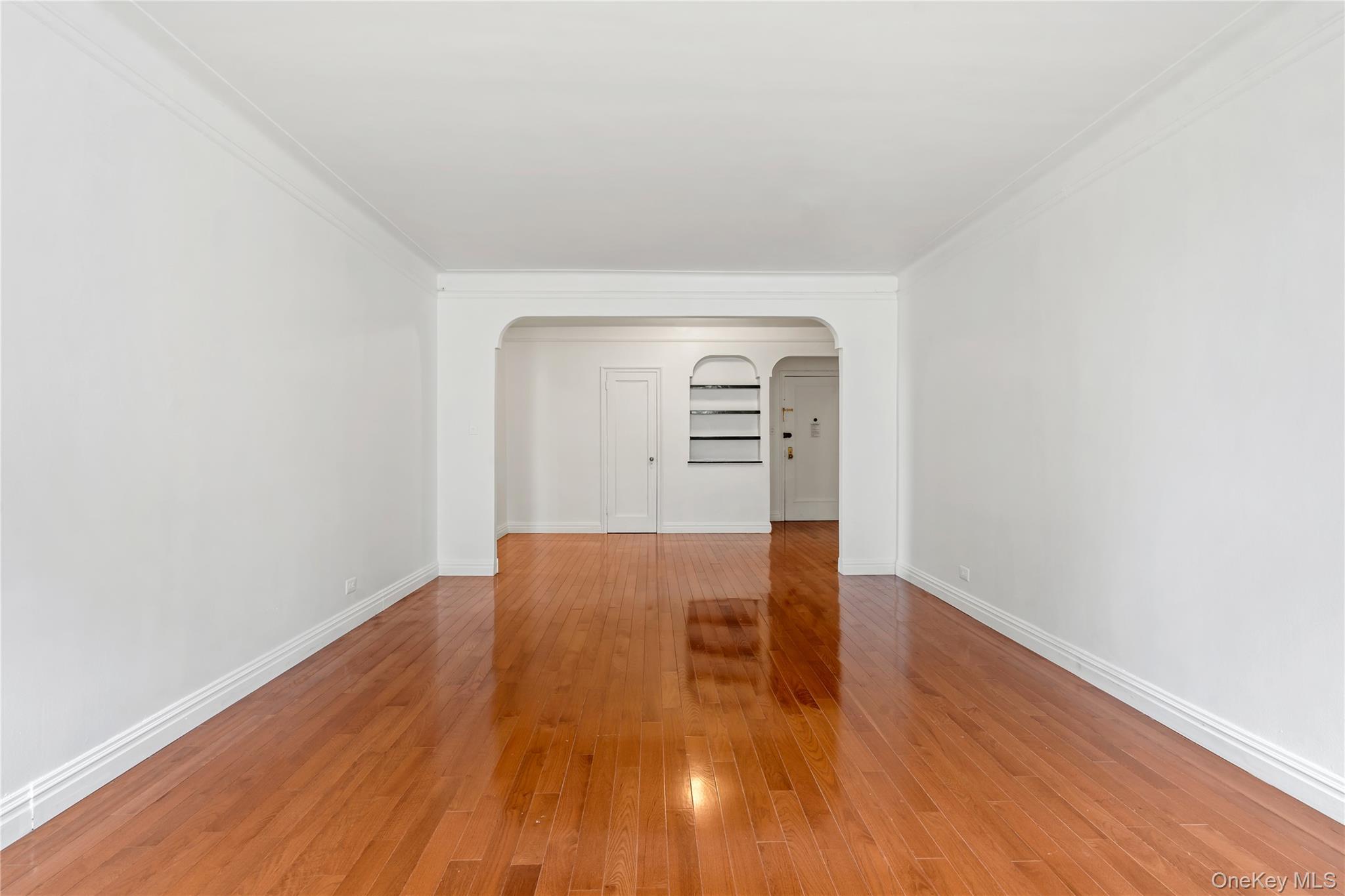 111-39 76th Road, Unit E7 Queens, NY 11375 - Photo 8 of 23 a view of empty room with wooden floor