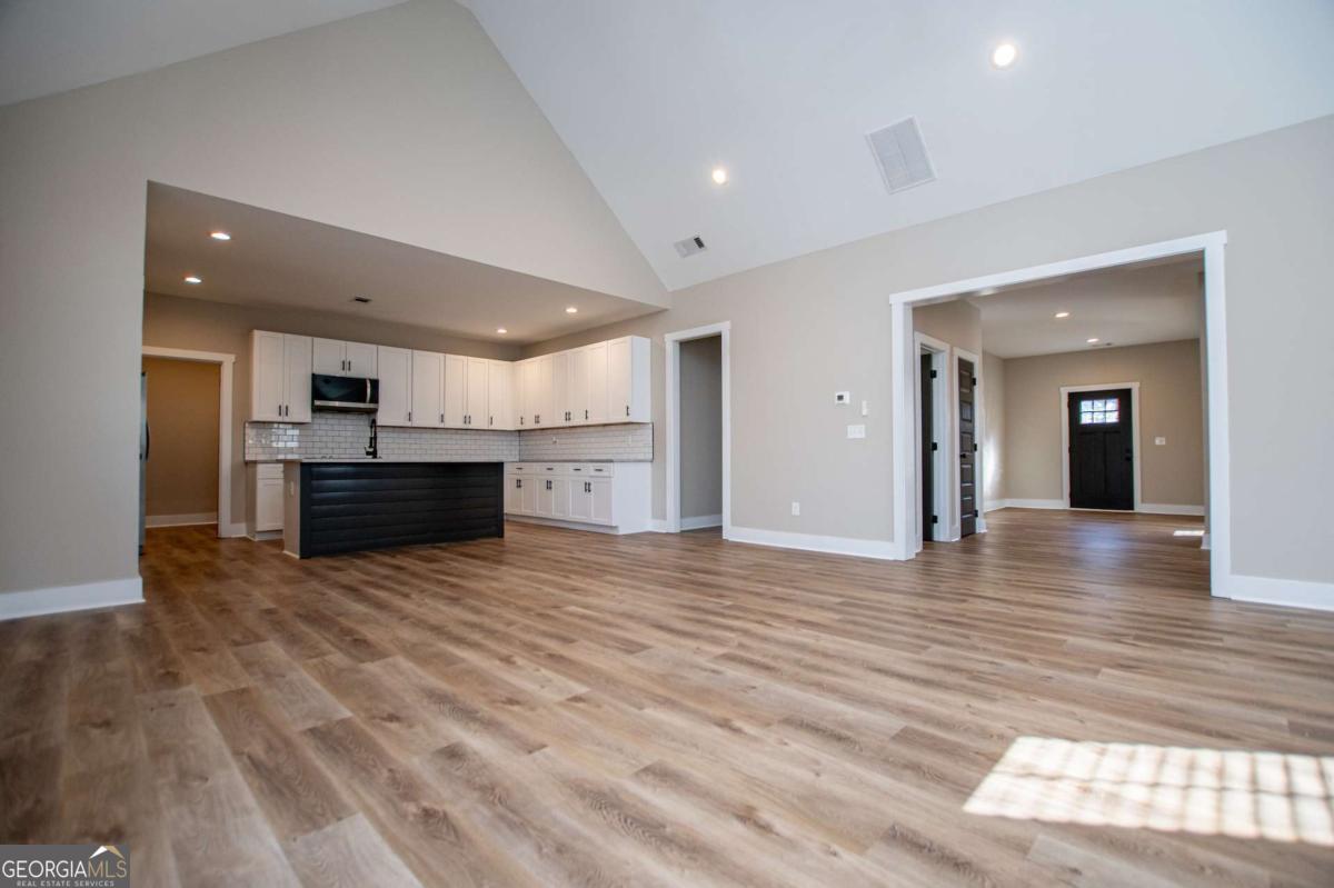 1605 5 Points Road Waco, GA 30182 - Photo 11 of 61 a view of a kitchen with a sink and a stove top oven