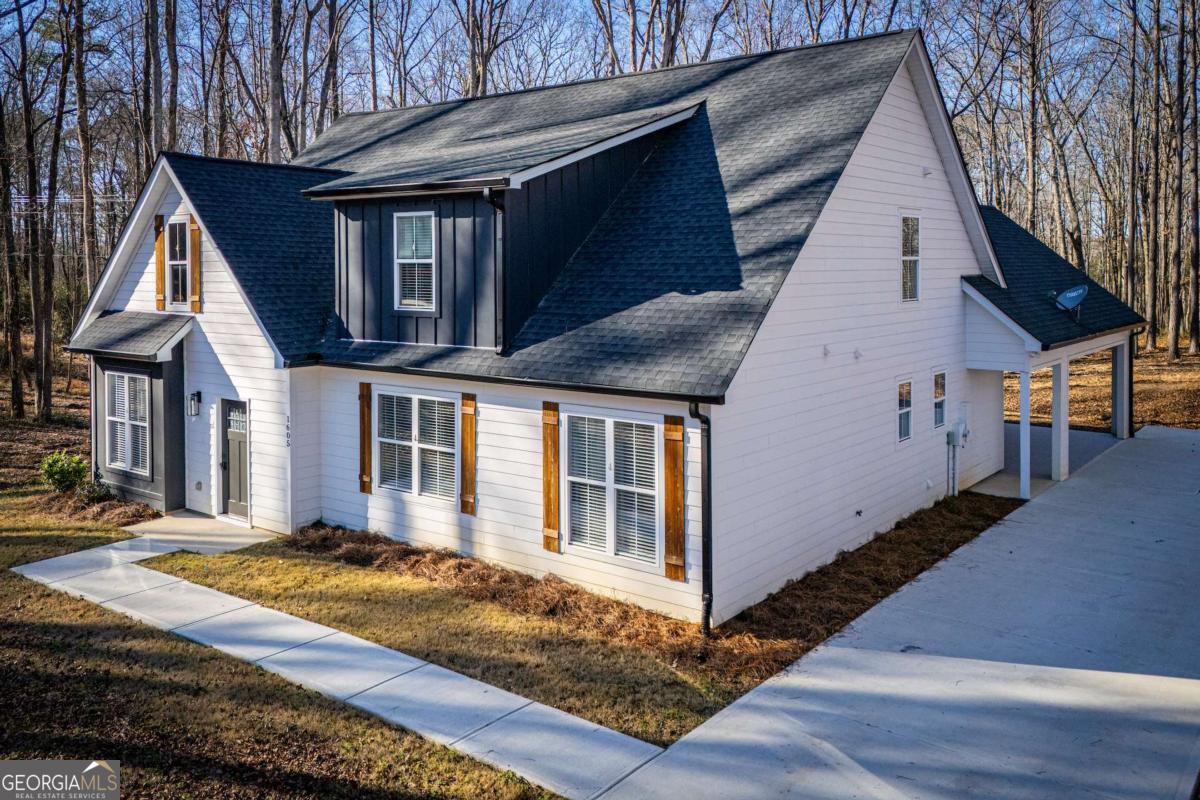 1605 5 Points Road Waco, GA 30182 - Photo 2 of 61 a view of a house with wooden fence