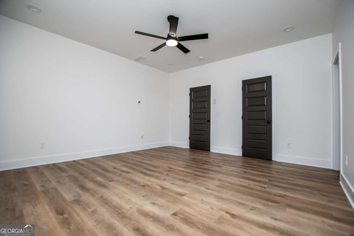 1605 5 Points Road Waco, GA 30182 - Photo 21 of 61 wooden floor in an empty room