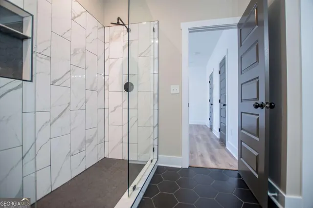 a bathroom with a double vanity sink mirror and shower