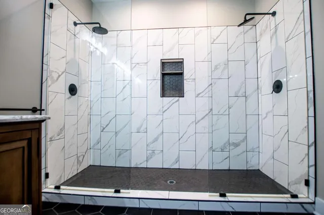 a bathroom with double vanity sink and a mirror
