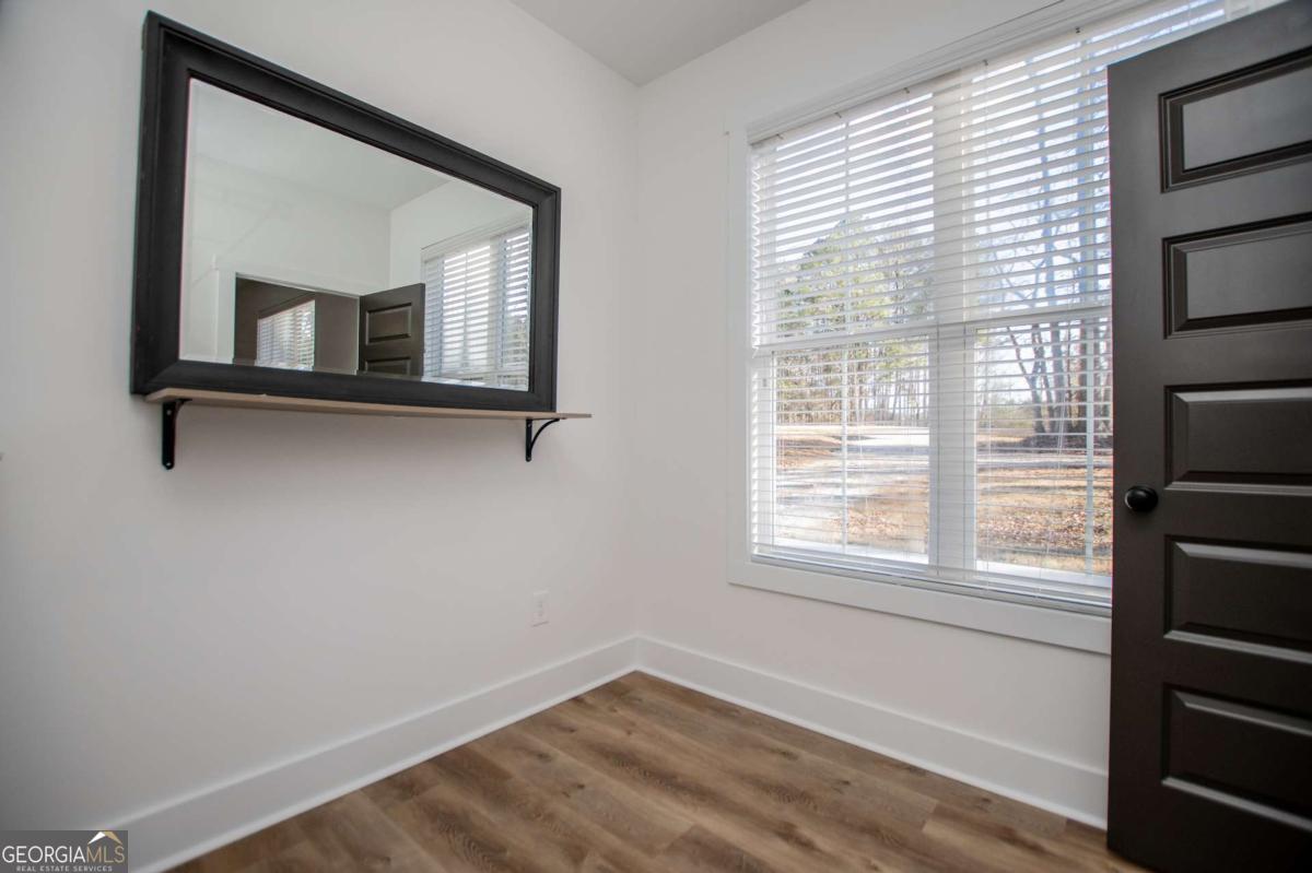 1605 5 Points Road Waco, GA 30182 - Photo 28 of 61 a view of wooden floor and windows in a room