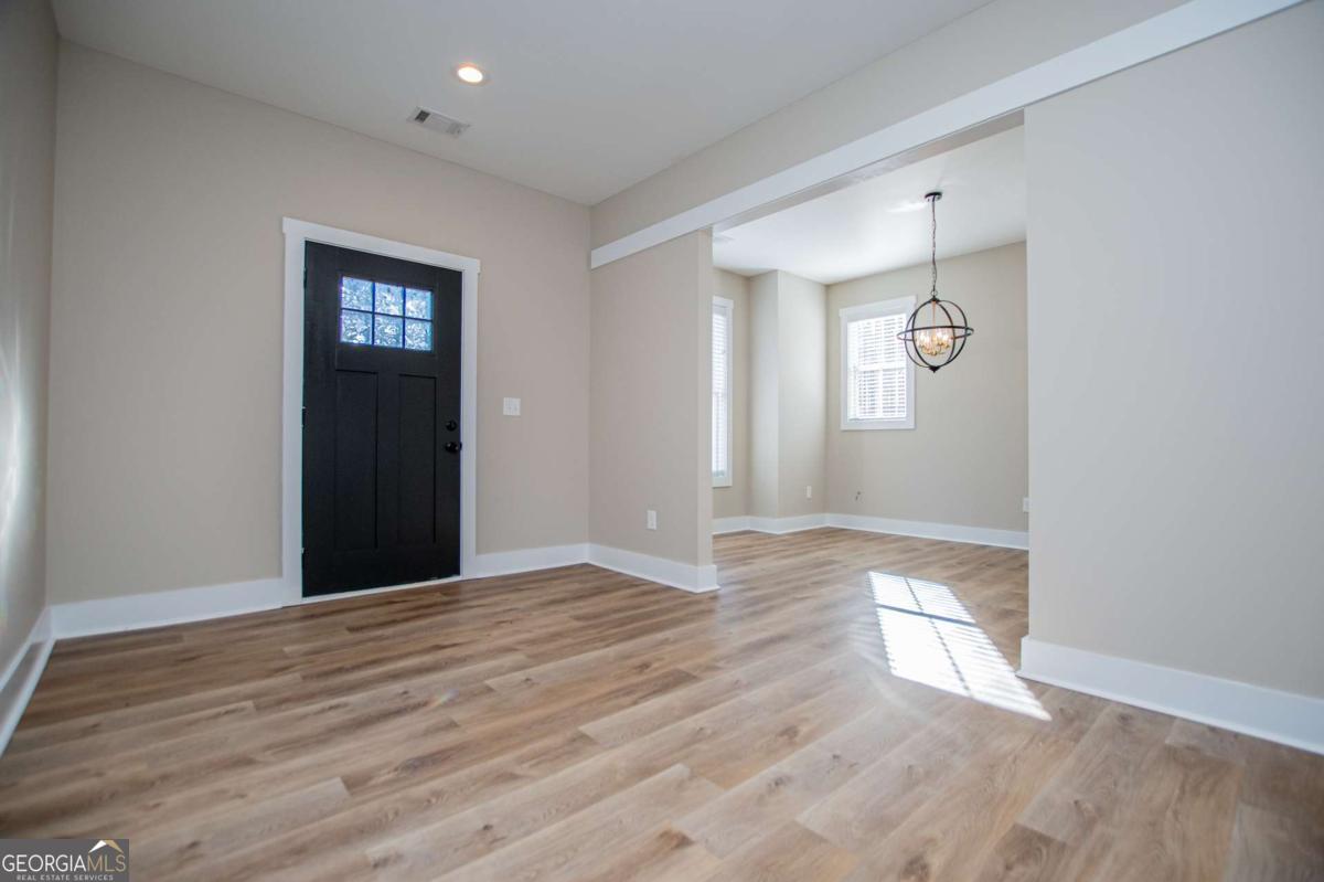 1605 5 Points Road Waco, GA 30182 - Photo 4 of 61 a view of an empty room with wooden floor