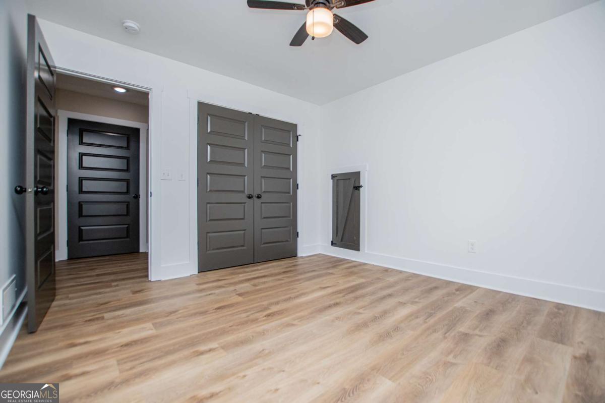 1605 5 Points Road Waco, GA 30182 - Photo 43 of 61 a view of empty room with wooden floor