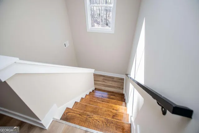 a view of a house with snow on the road