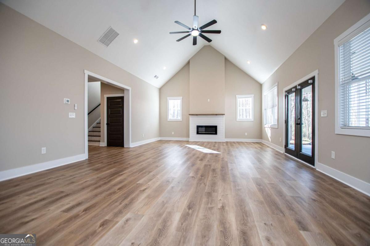1605 5 Points Road Waco, GA 30182 - Photo 48 of 61 a view of empty room with wooden floor and fireplace