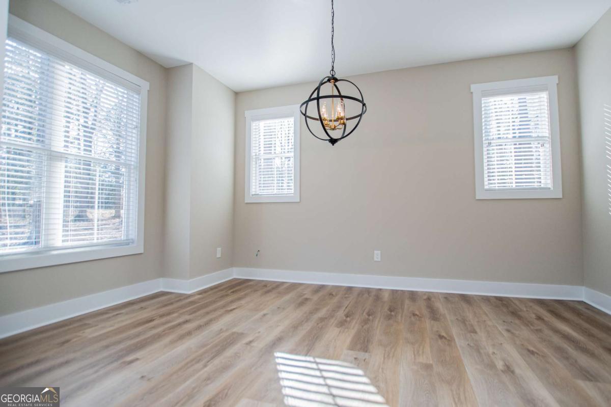 1605 5 Points Road Waco, GA 30182 - Photo 6 of 61 a view of empty room with window and chandelier