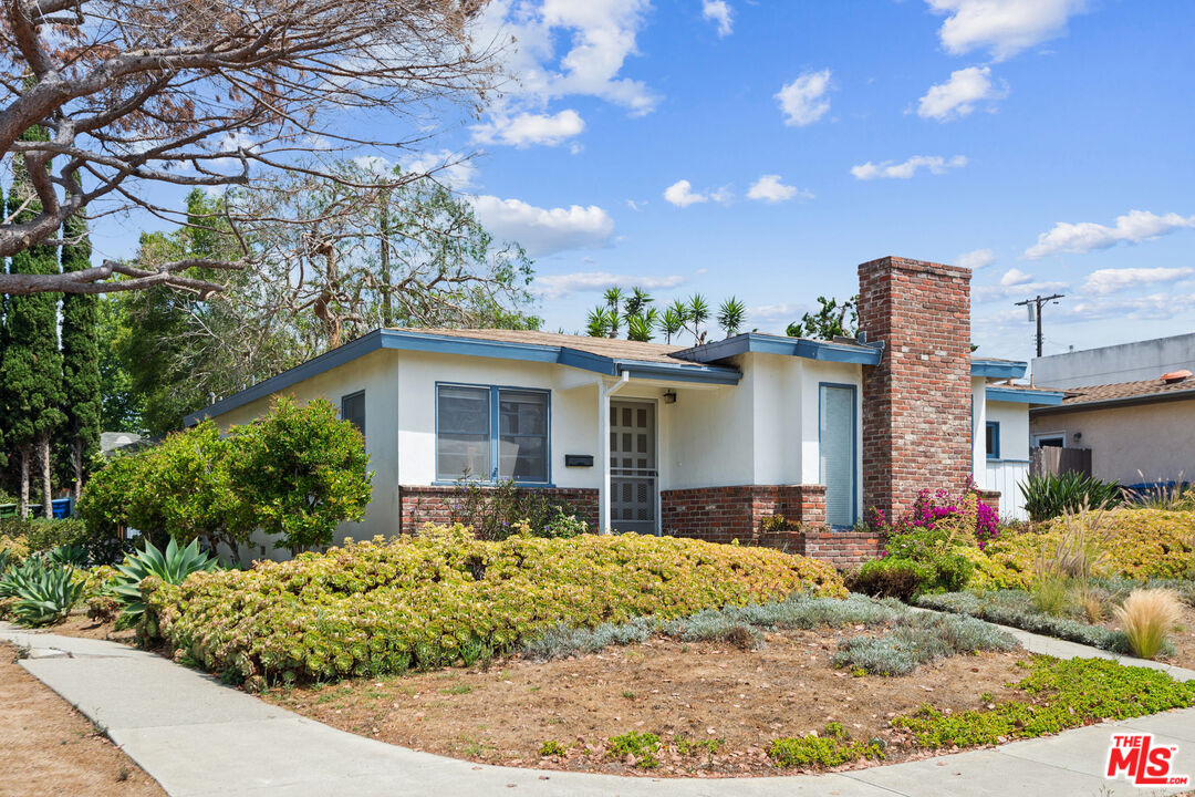 12753 Appleton Way Los Angeles, CA 90066 - Photo 1 of 31 a front view of a house with a yard and potted plants