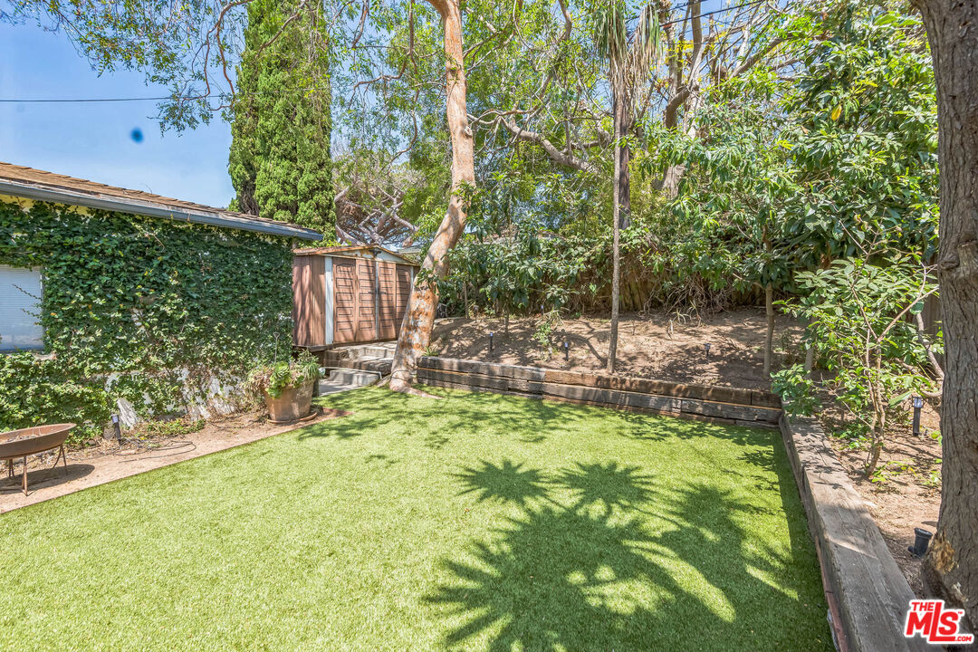 12753 Appleton Way Los Angeles, CA 90066 - Photo 16 of 31 a backyard of a house with table and chairs