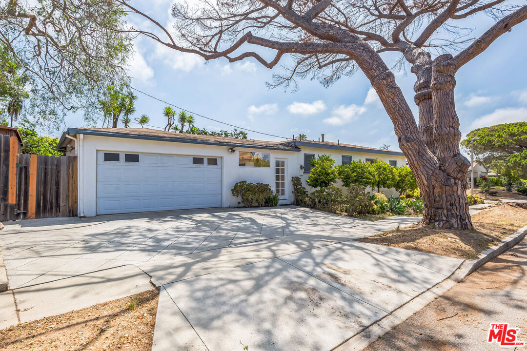 12753 Appleton Way Los Angeles, CA 90066 - Photo 2 of 31 a house with a tree in front of it
