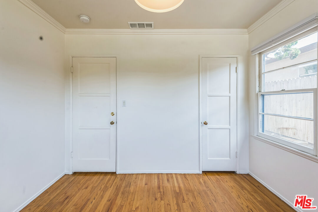12753 Appleton Way Los Angeles, CA 90066 - Photo 22 of 31 a view of an empty room with wooden floor and a window