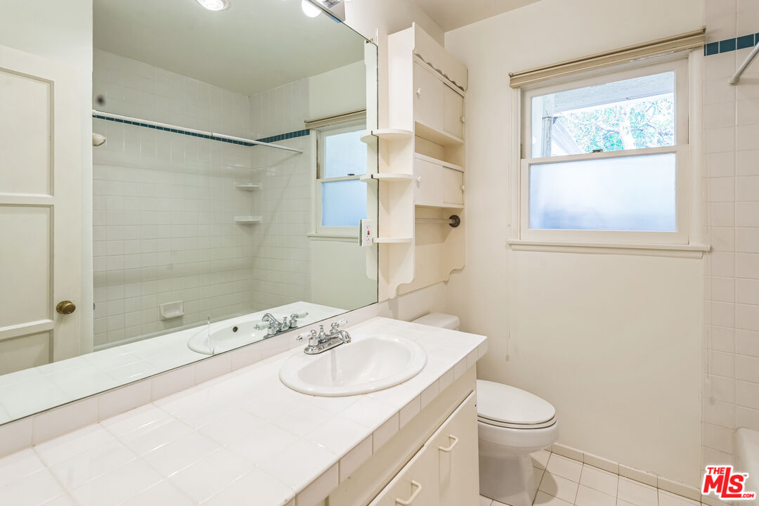12753 Appleton Way Los Angeles, CA 90066 - Photo 24 of 31 a bathroom with a sink toilet and shower