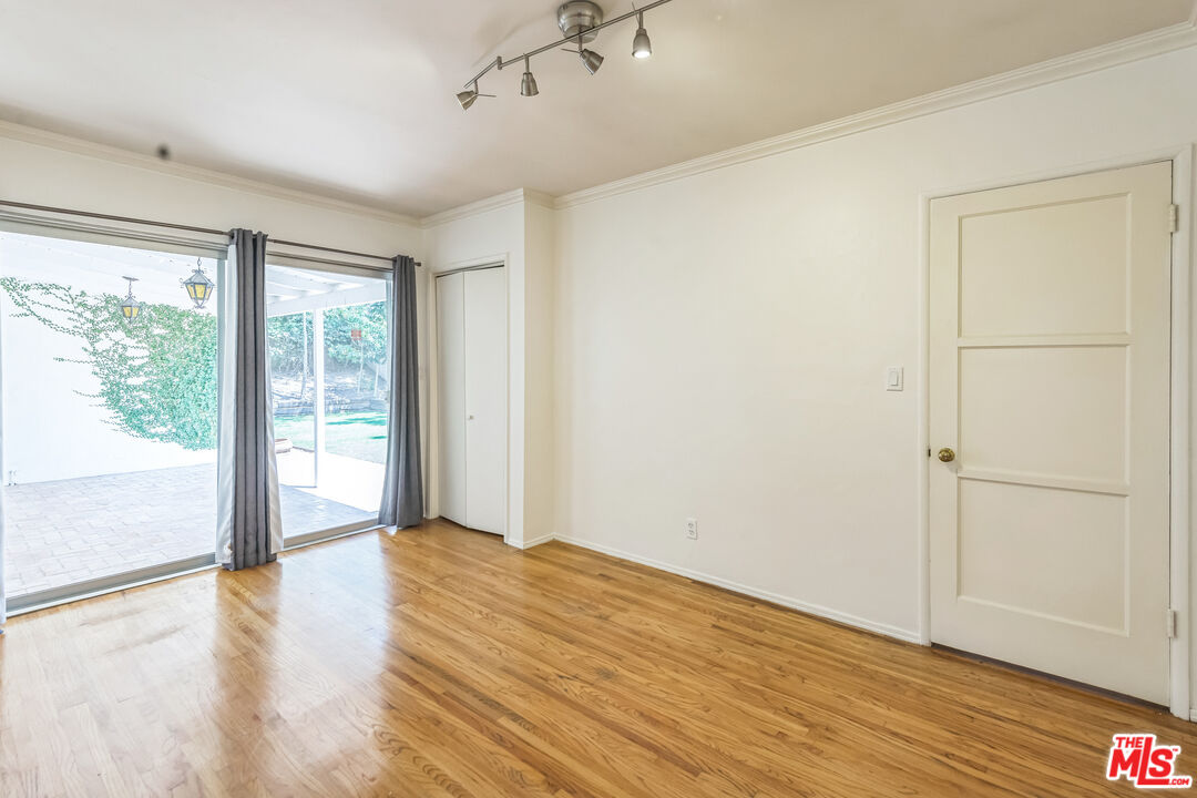 12753 Appleton Way Los Angeles, CA 90066 - Photo 25 of 31 a view of an empty room with wooden floor and a window
