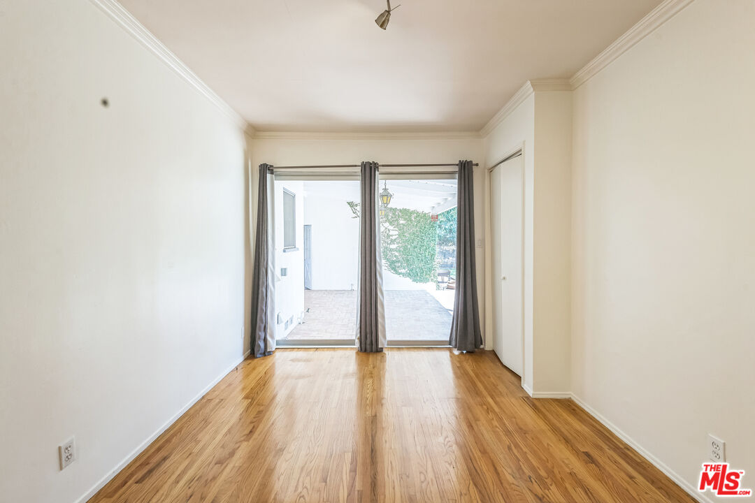 12753 Appleton Way Los Angeles, CA 90066 - Photo 26 of 31 a view of empty room with wooden floor and fan