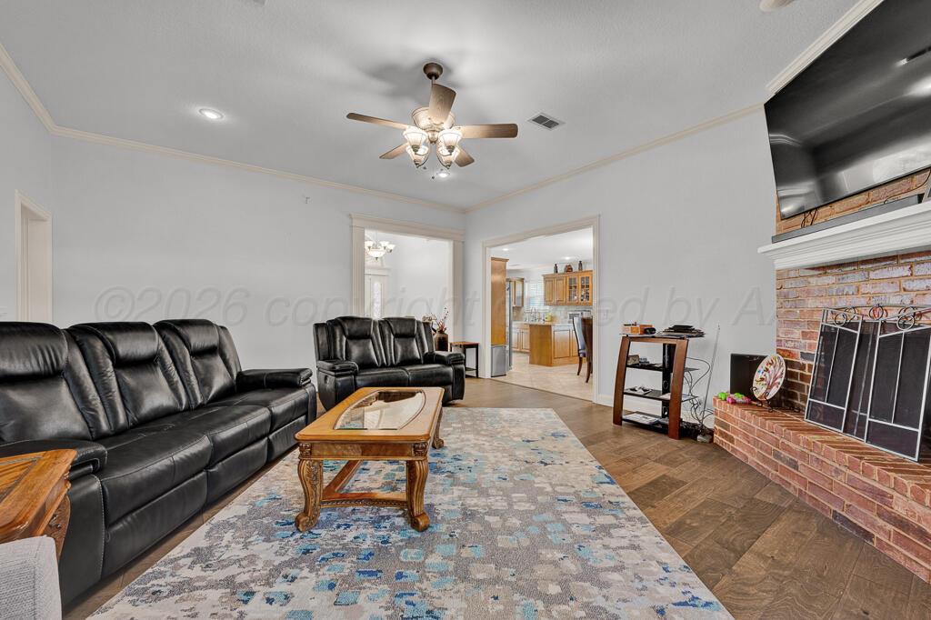 6604 Pepper Tree Place Amarillo, TX 79124 - Photo 13 of 28 a living room with furniture and a flat screen tv