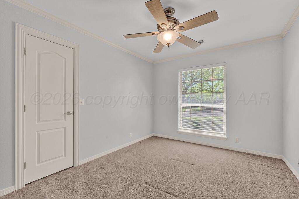 6604 Pepper Tree Place Amarillo, TX 79124 - Photo 21 of 28 an empty room with windows and fan