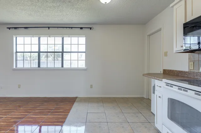 a view of a kitchen with washer and dryer